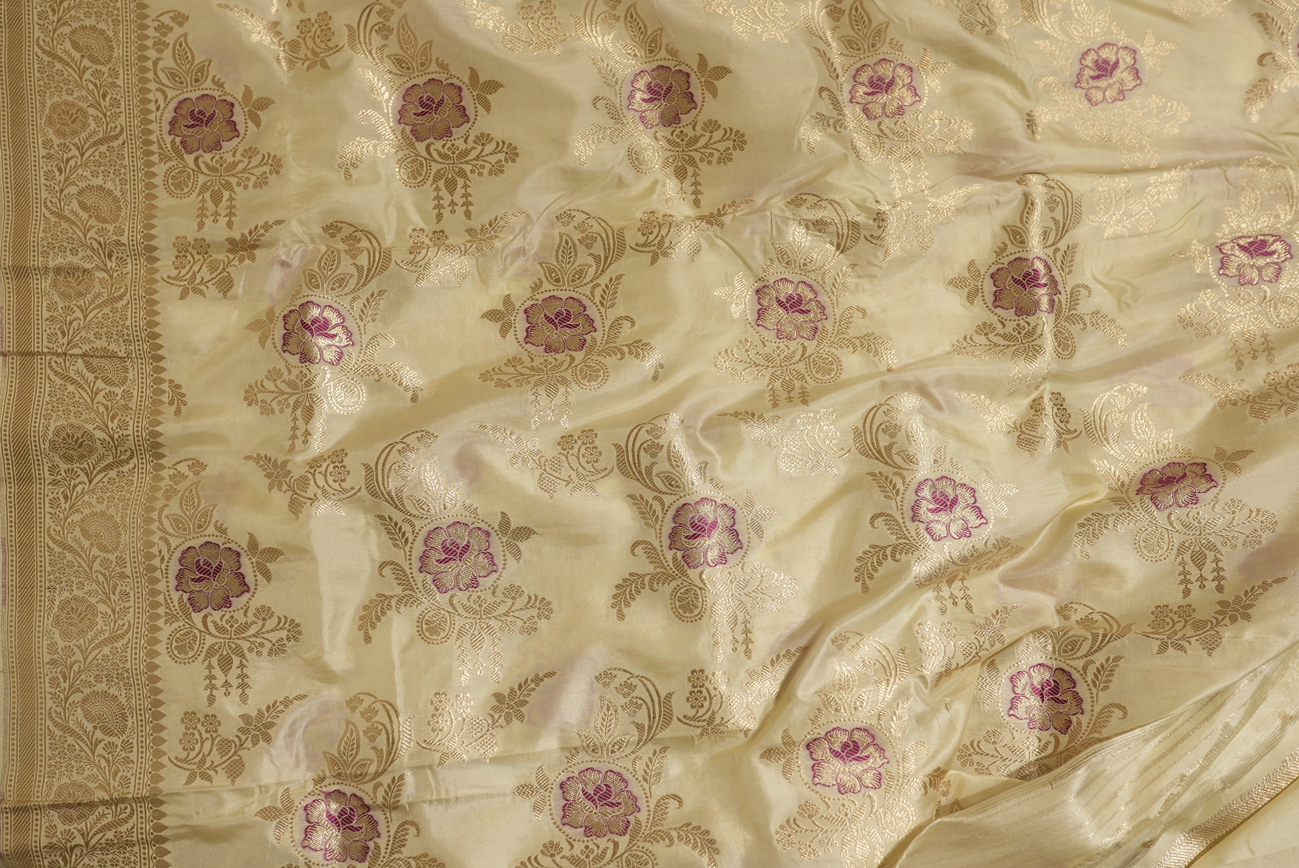 Beige banarasi saree with golden zari floral motifs