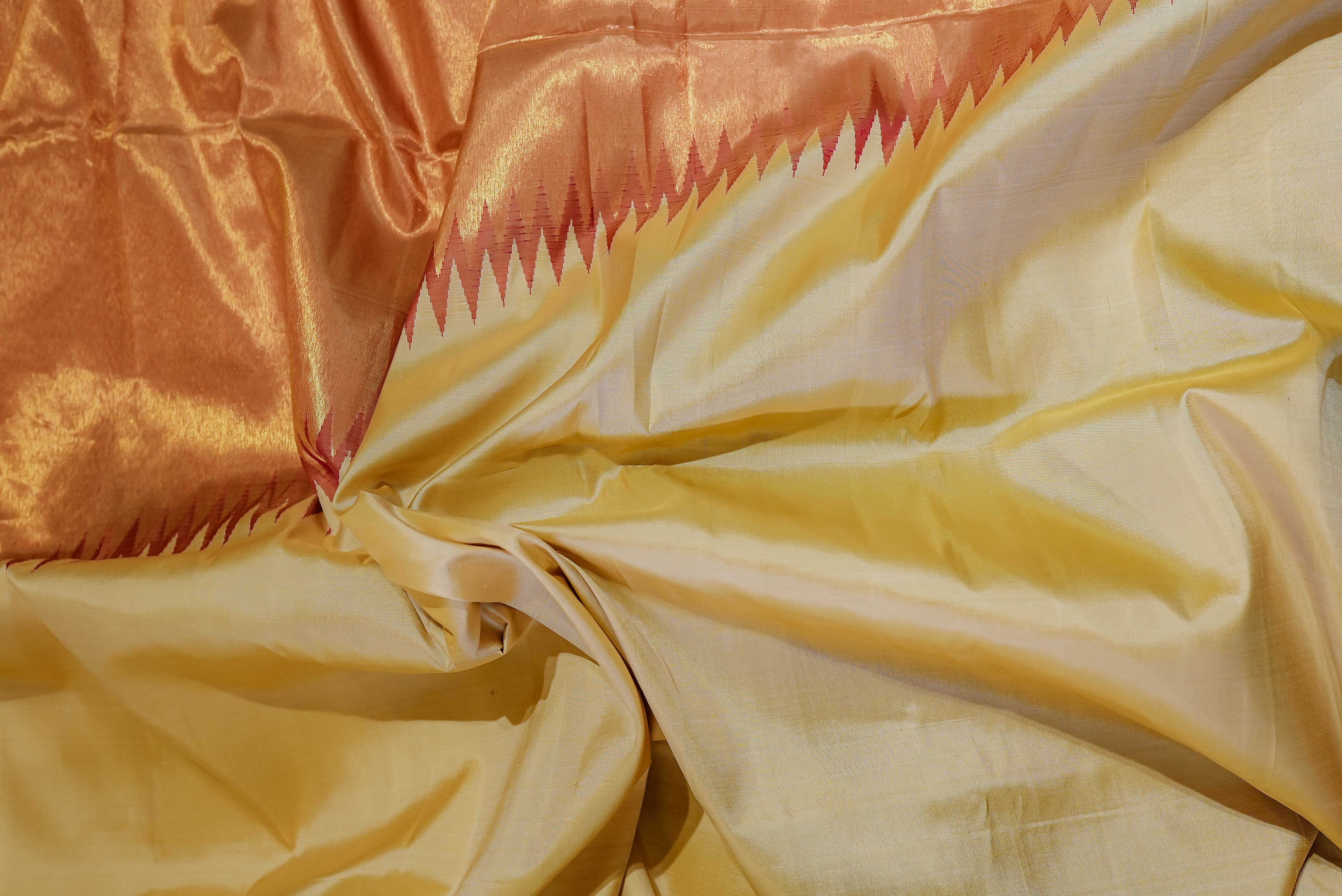 Beige kanjiwaram saree  with orange rising boarder