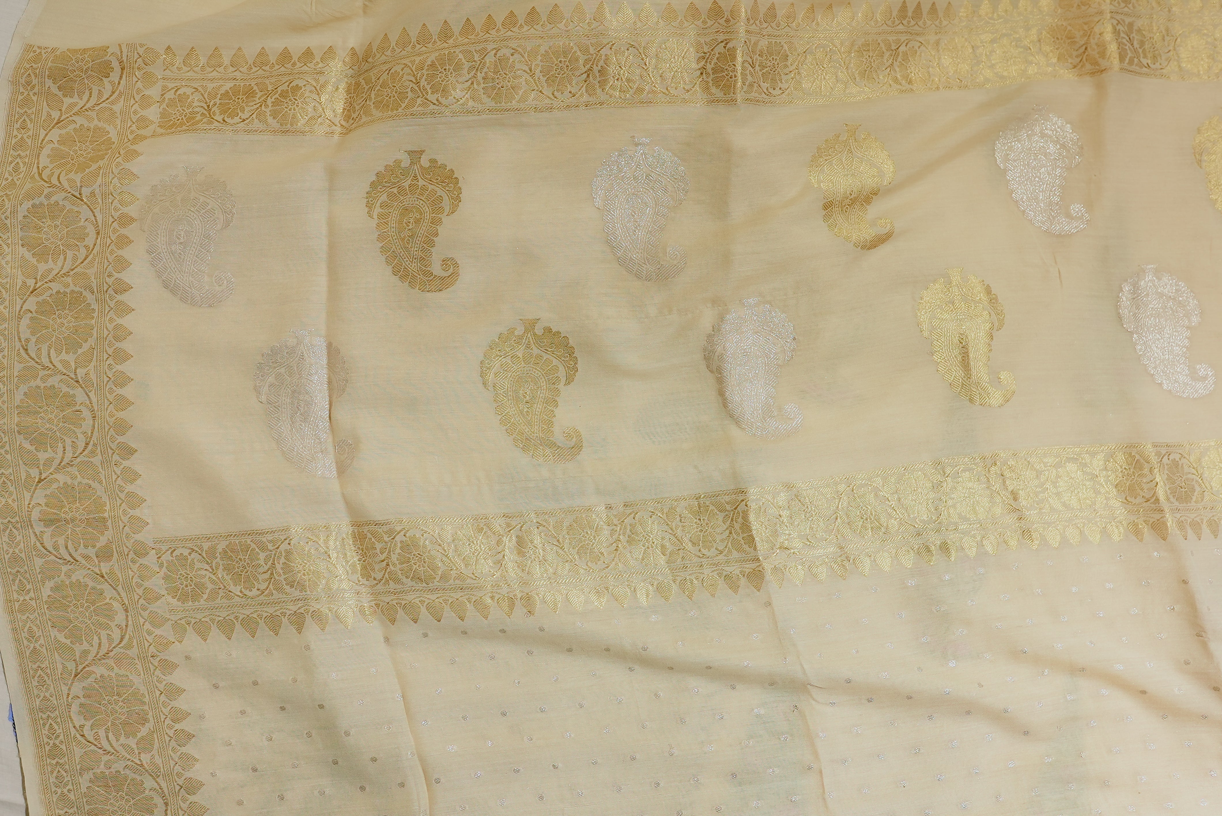 Beige moonga silk with golden but is and boarders