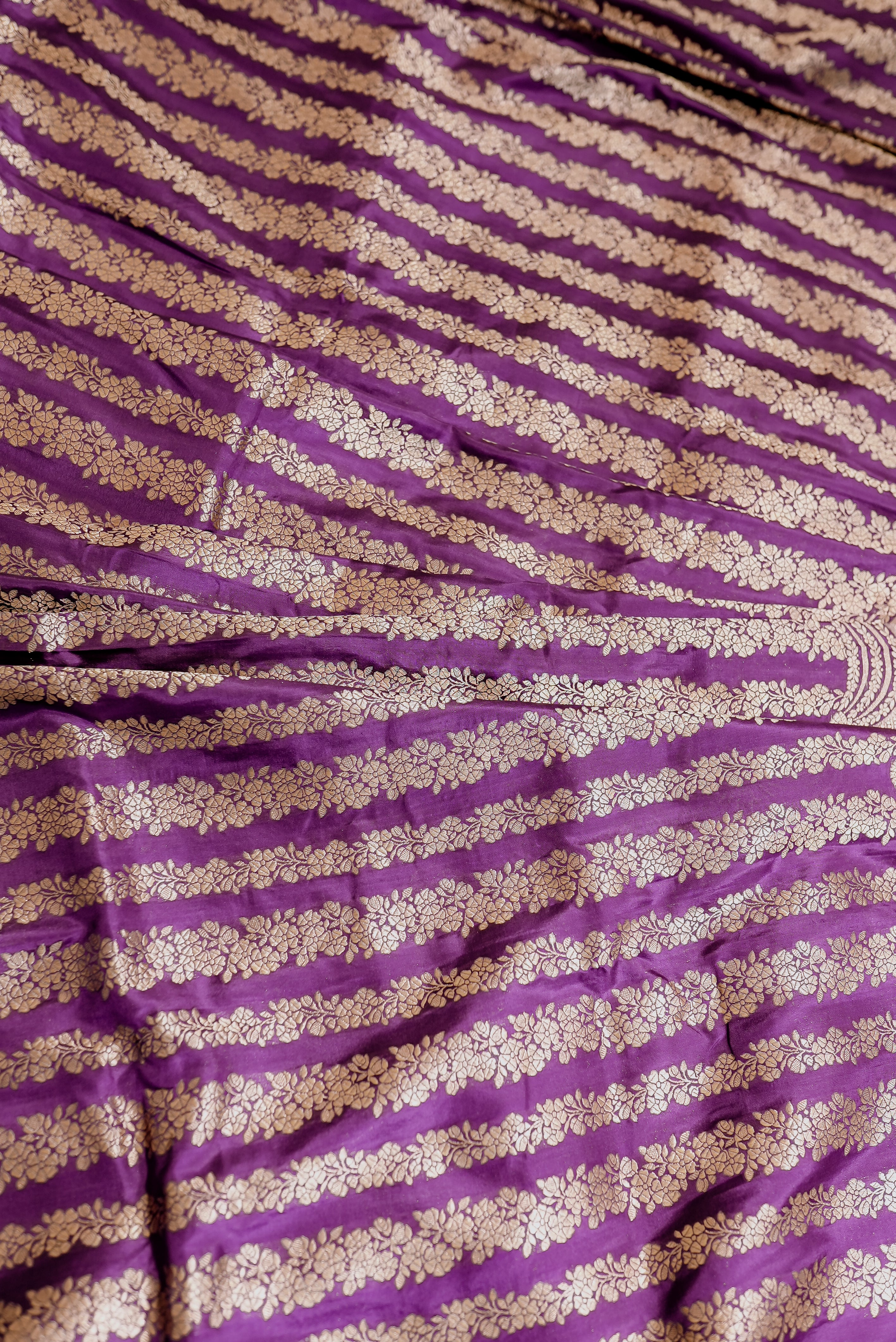 Purple banarasi saree with gold zari motifs and boarder