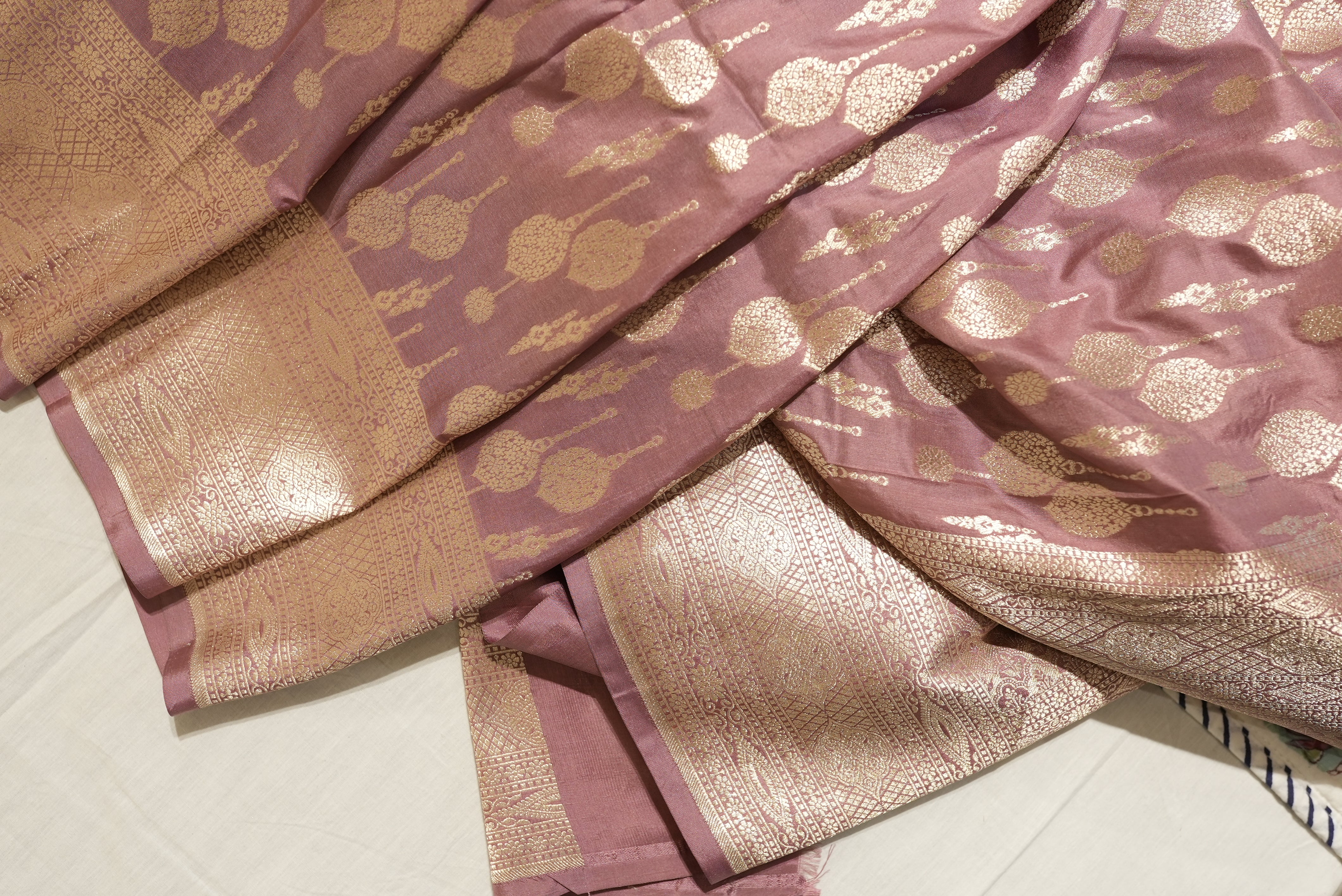 Peach banarasi saree with champagne gold zari boarder and motifs