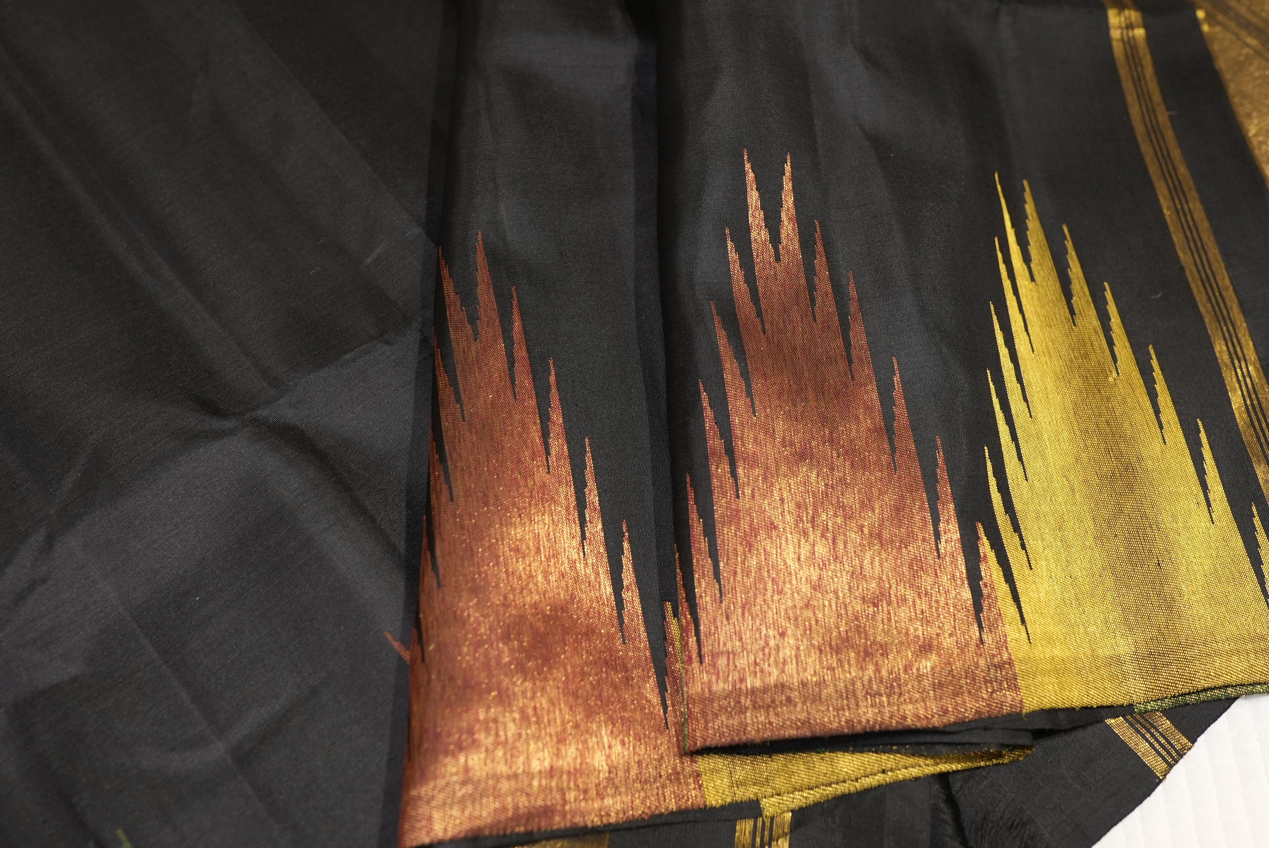 Black kanjiwaram saree with zari temple boarder