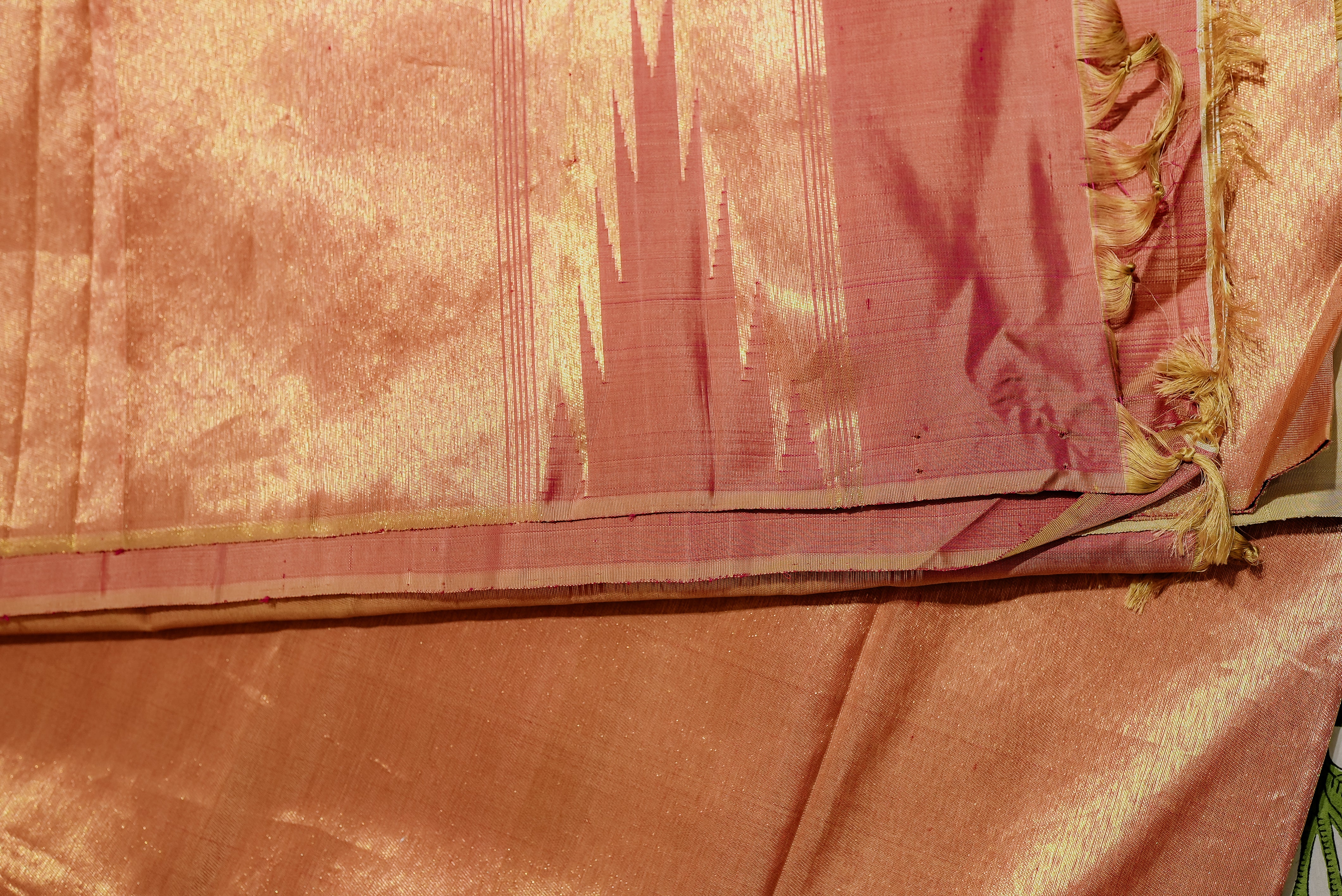 Beige kanjiwaram saree  with orange rising boarder