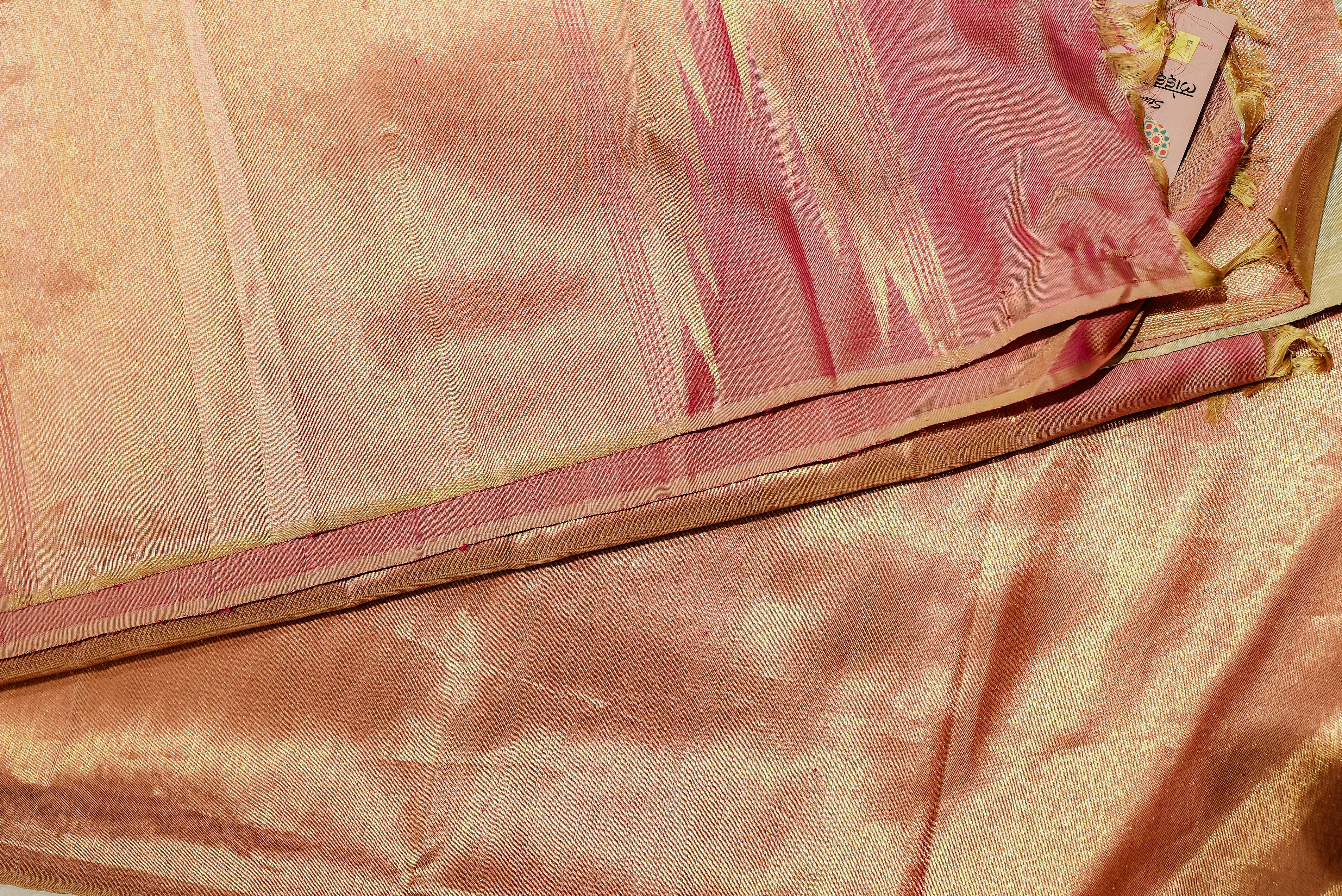 Beige kanjiwaram saree  with orange rising boarder