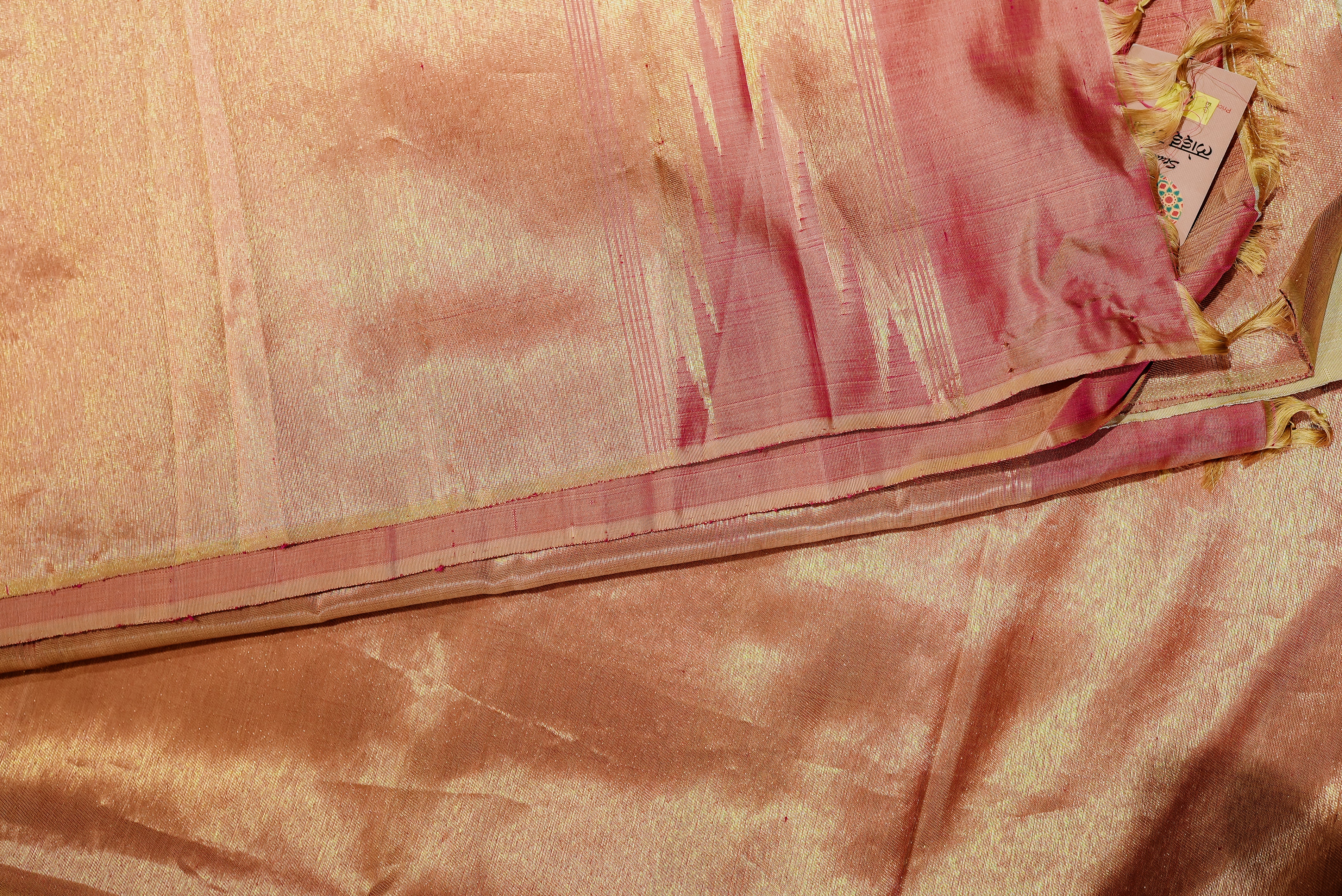 Beige kanjiwaram saree  with orange rising boarder