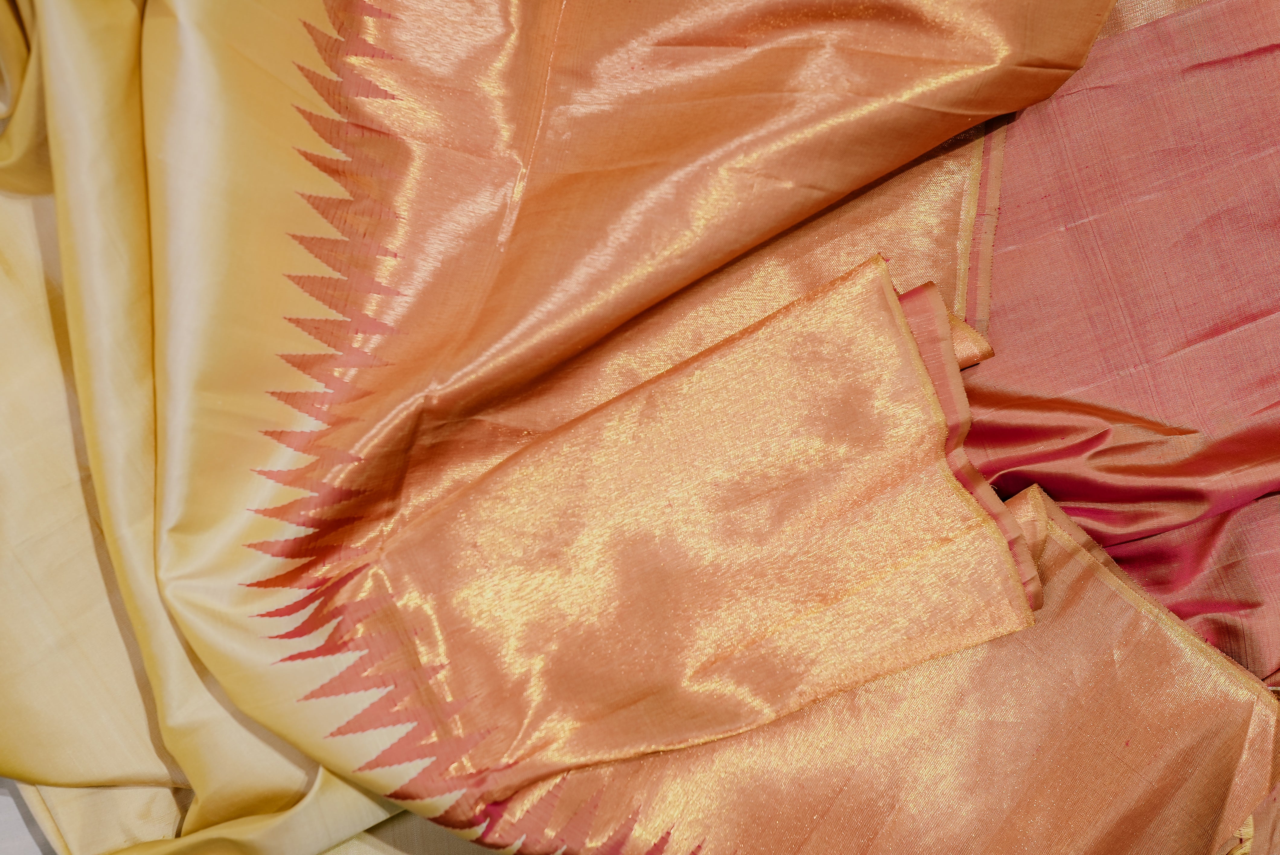 Beige kanjiwaram saree  with orange rising boarder