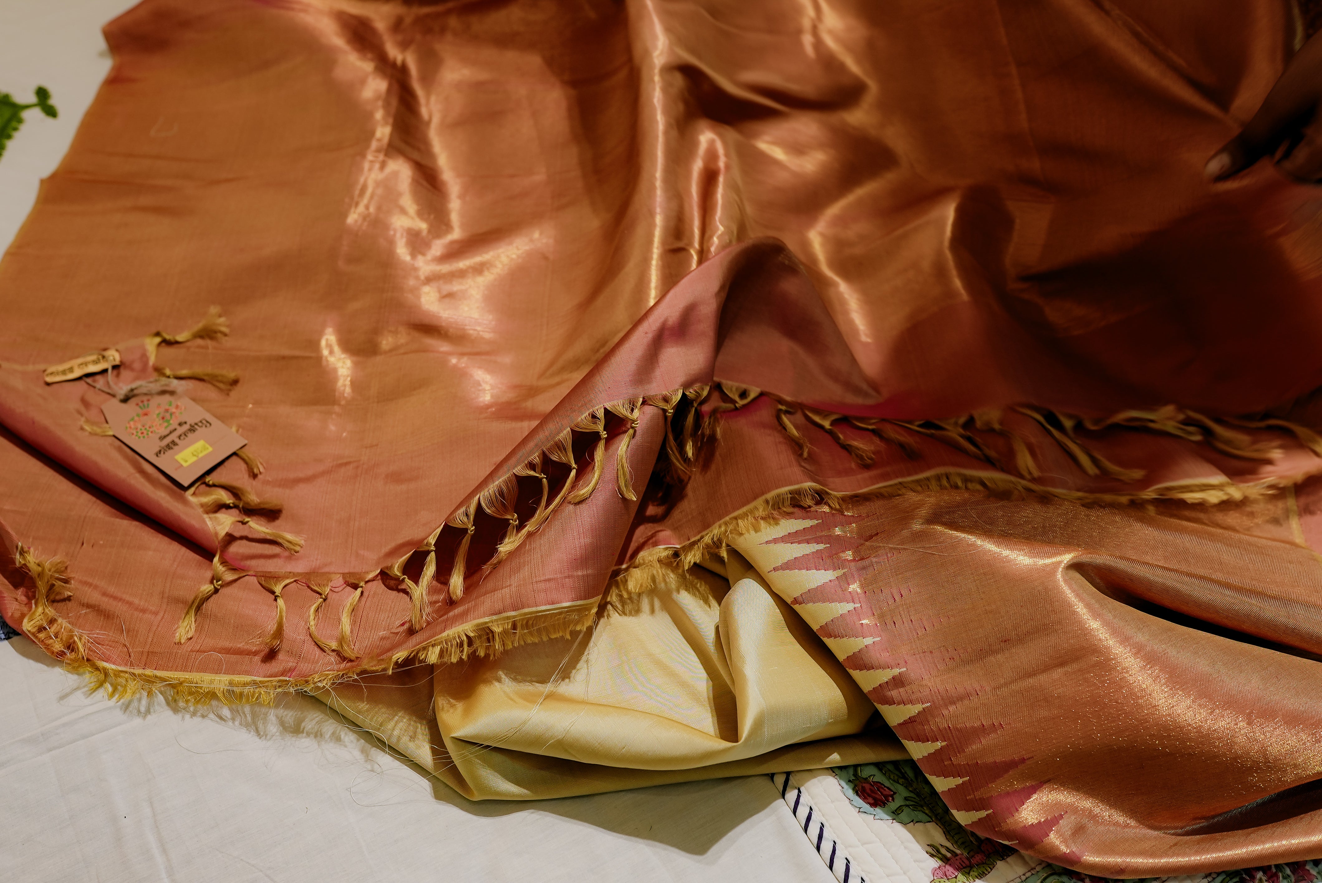 Beige kanjiwaram saree  with orange rising boarder