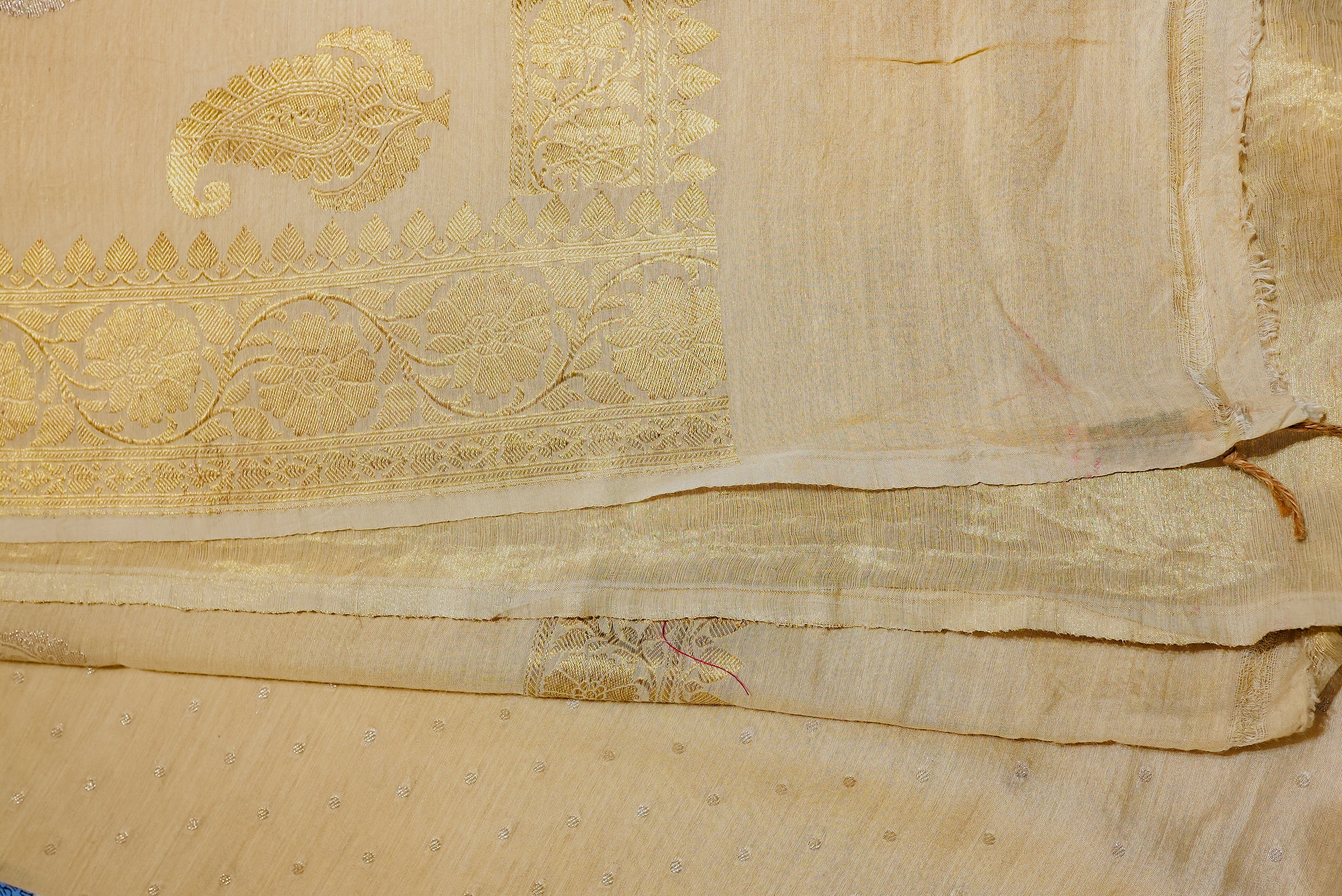 Beige moonga silk with golden but is and boarders