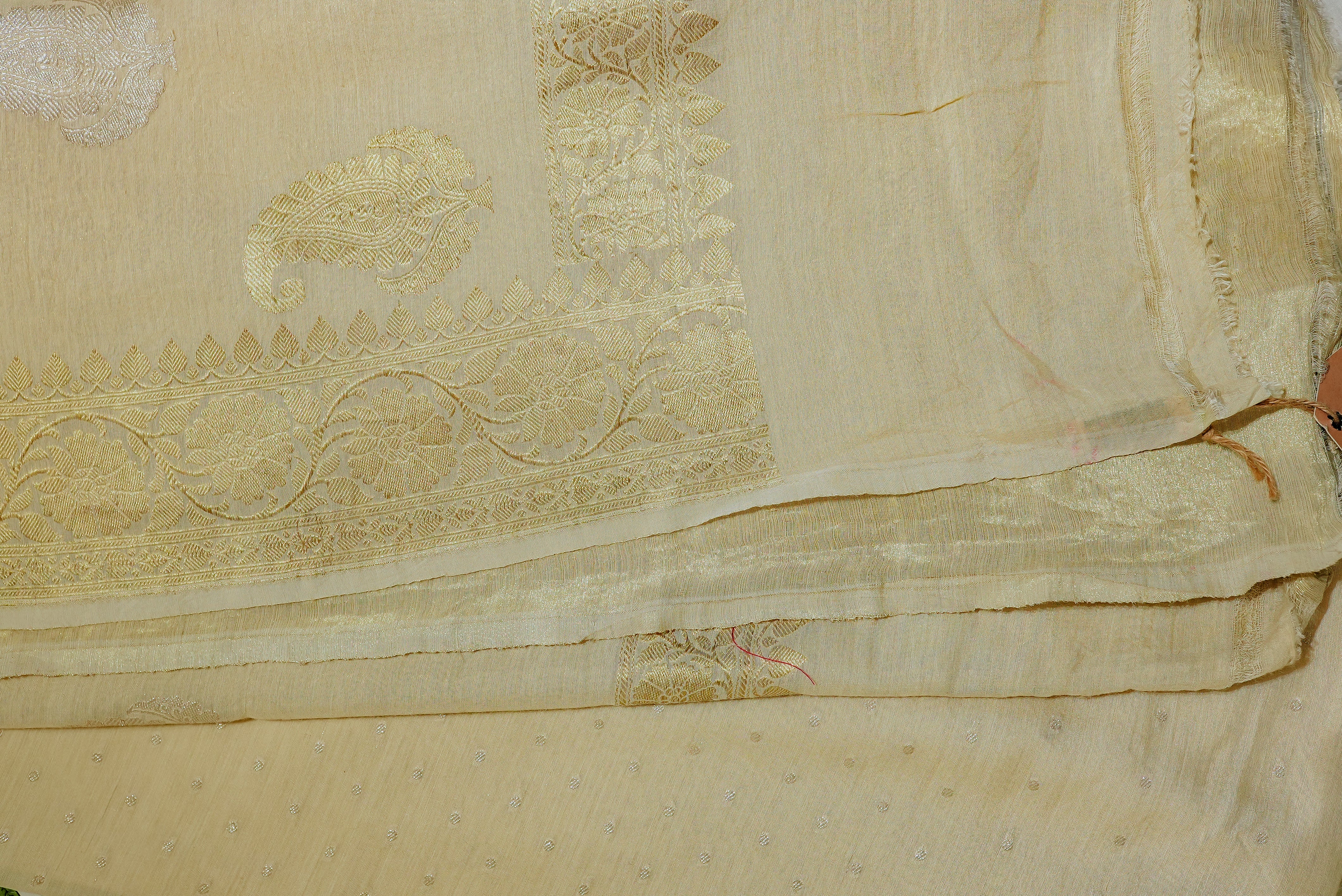 Beige moonga silk with golden but is and boarders