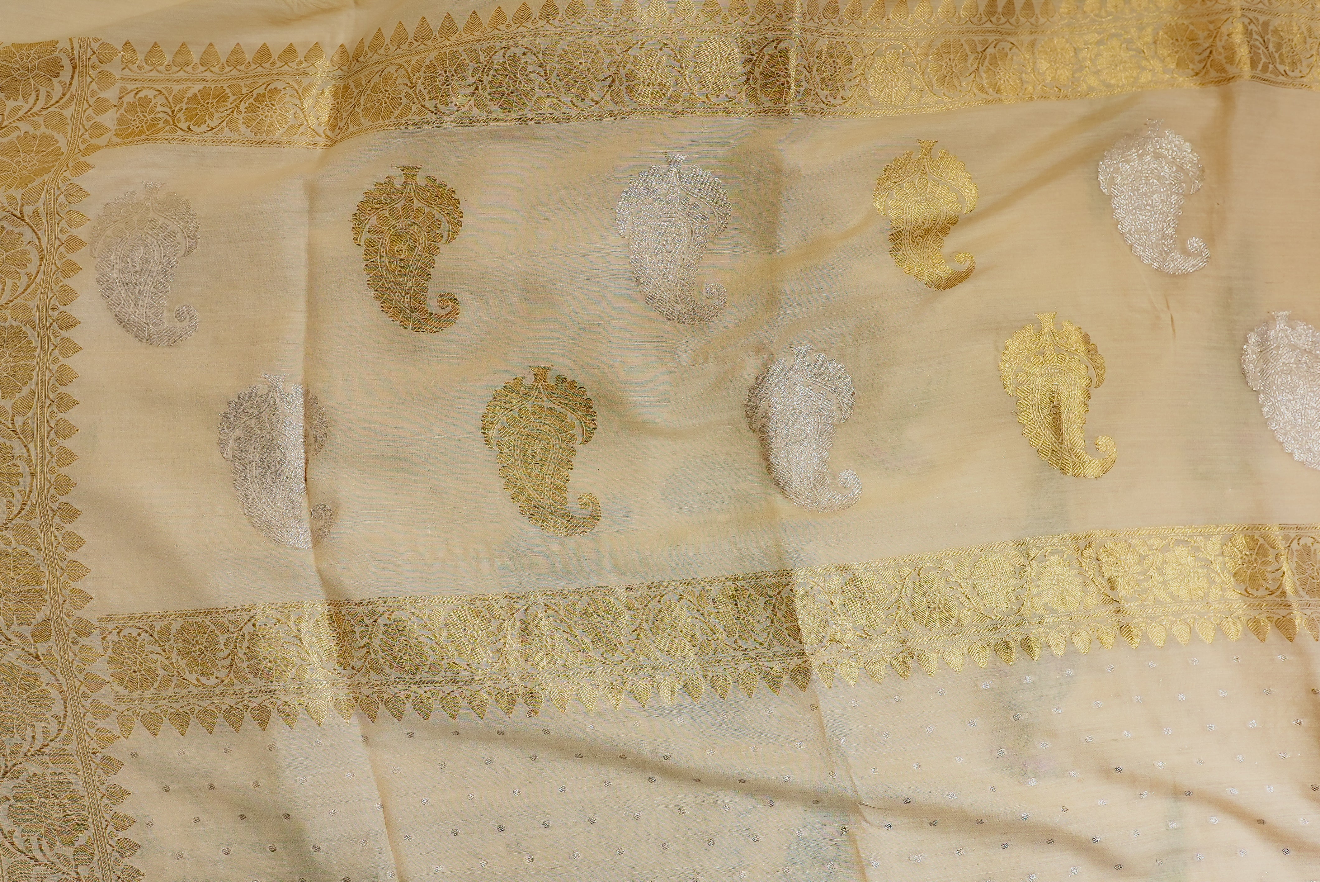 Beige moonga silk with golden but is and boarders