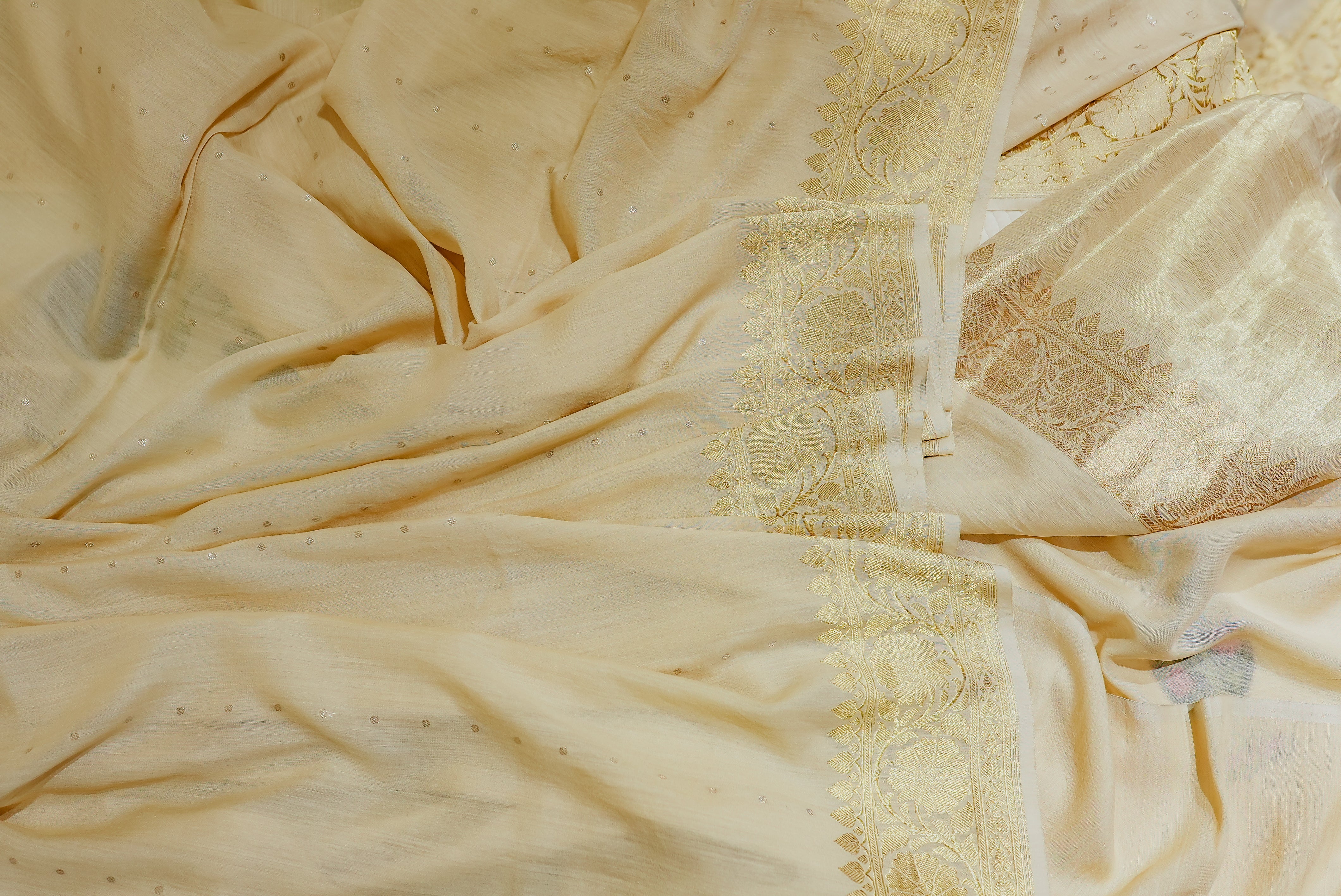 Beige moonga silk with golden but is and boarders