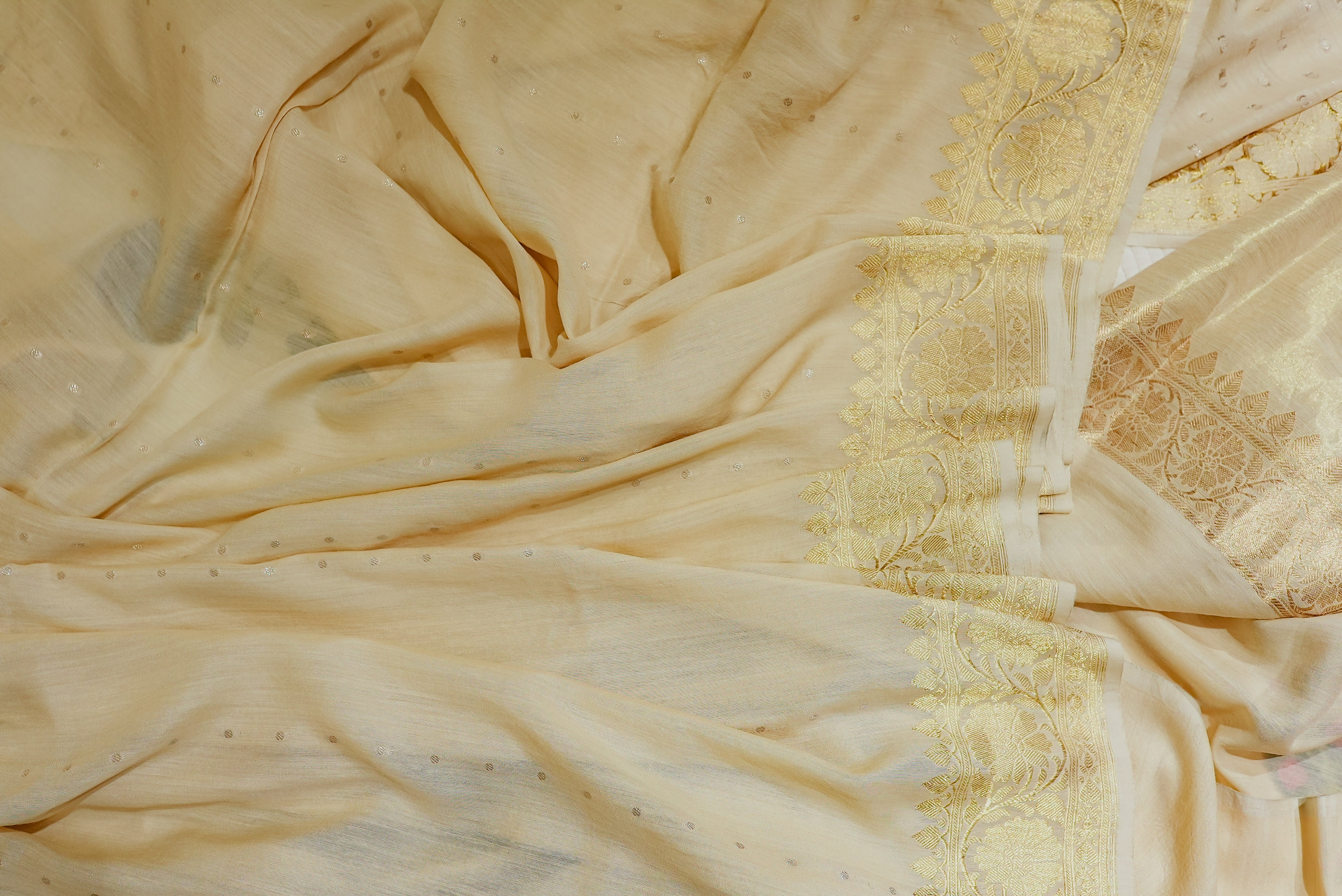 Beige moonga silk with golden but is and boarders