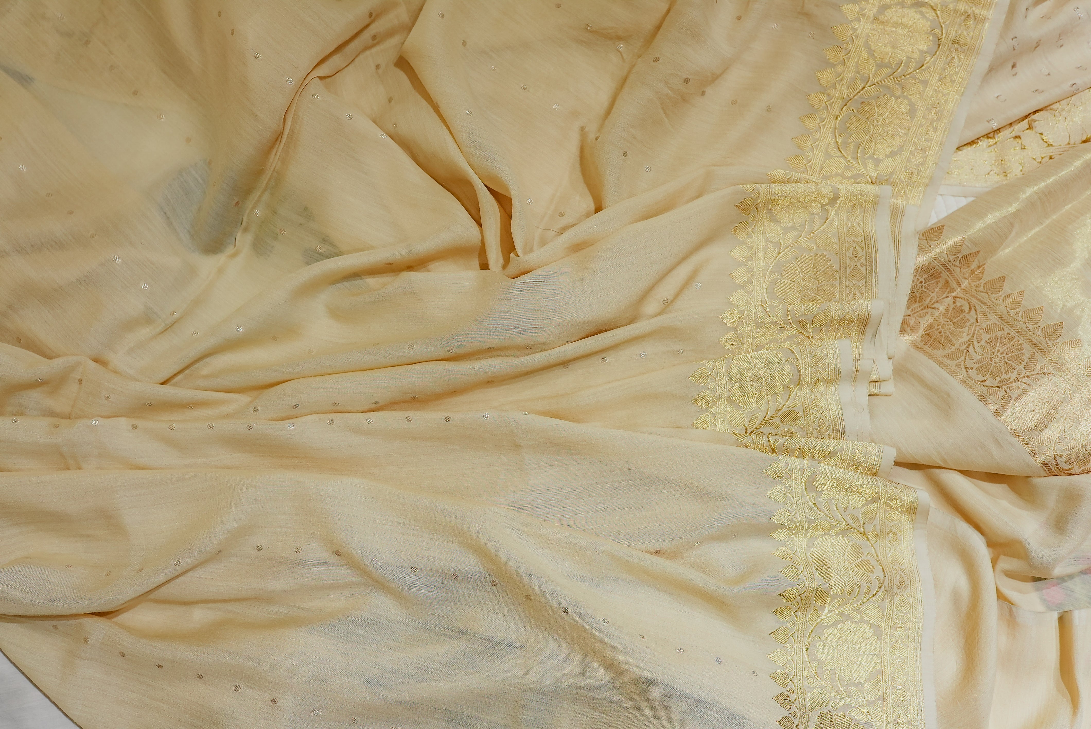 Beige moonga silk with golden but is and boarders