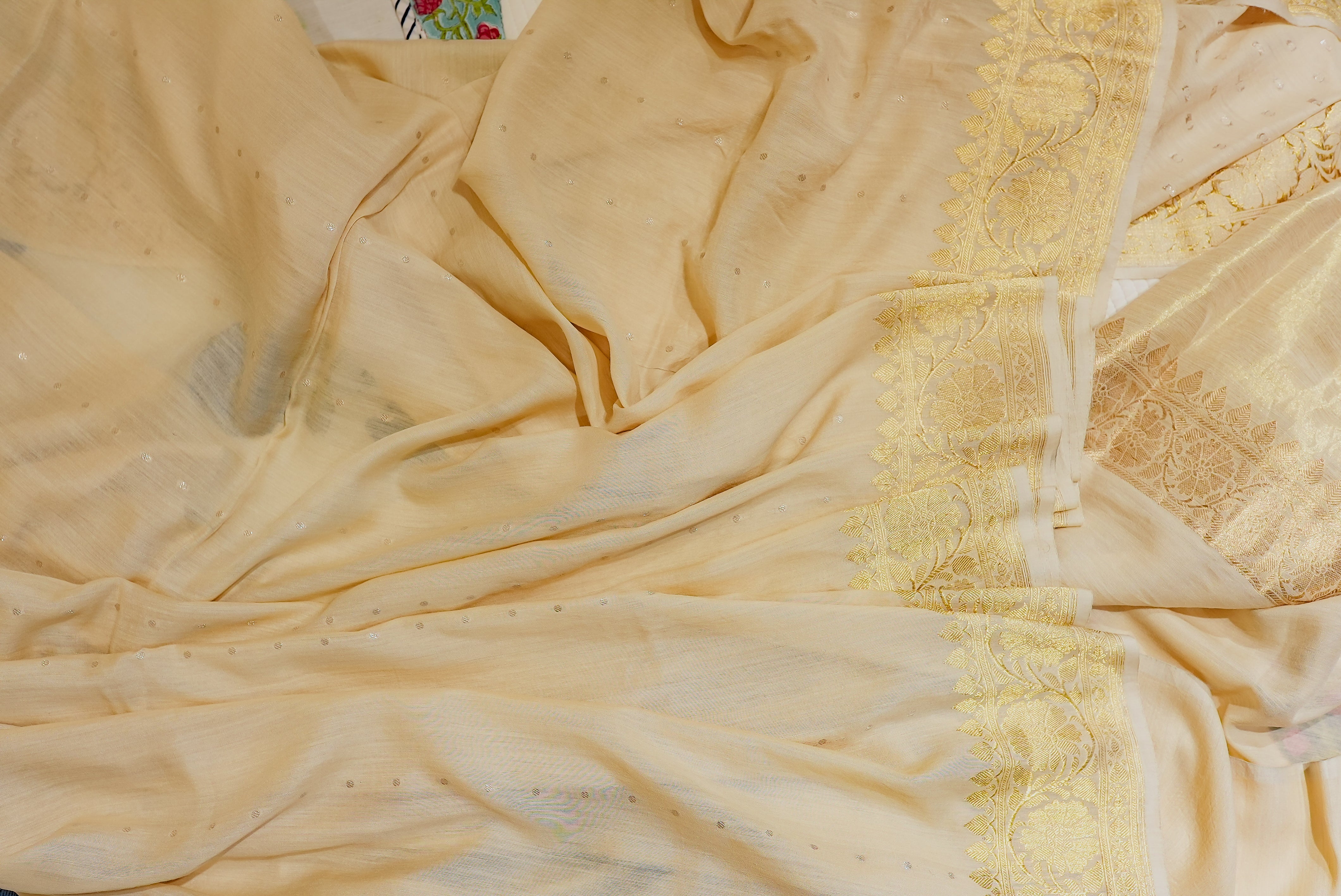 Beige moonga silk with golden but is and boarders