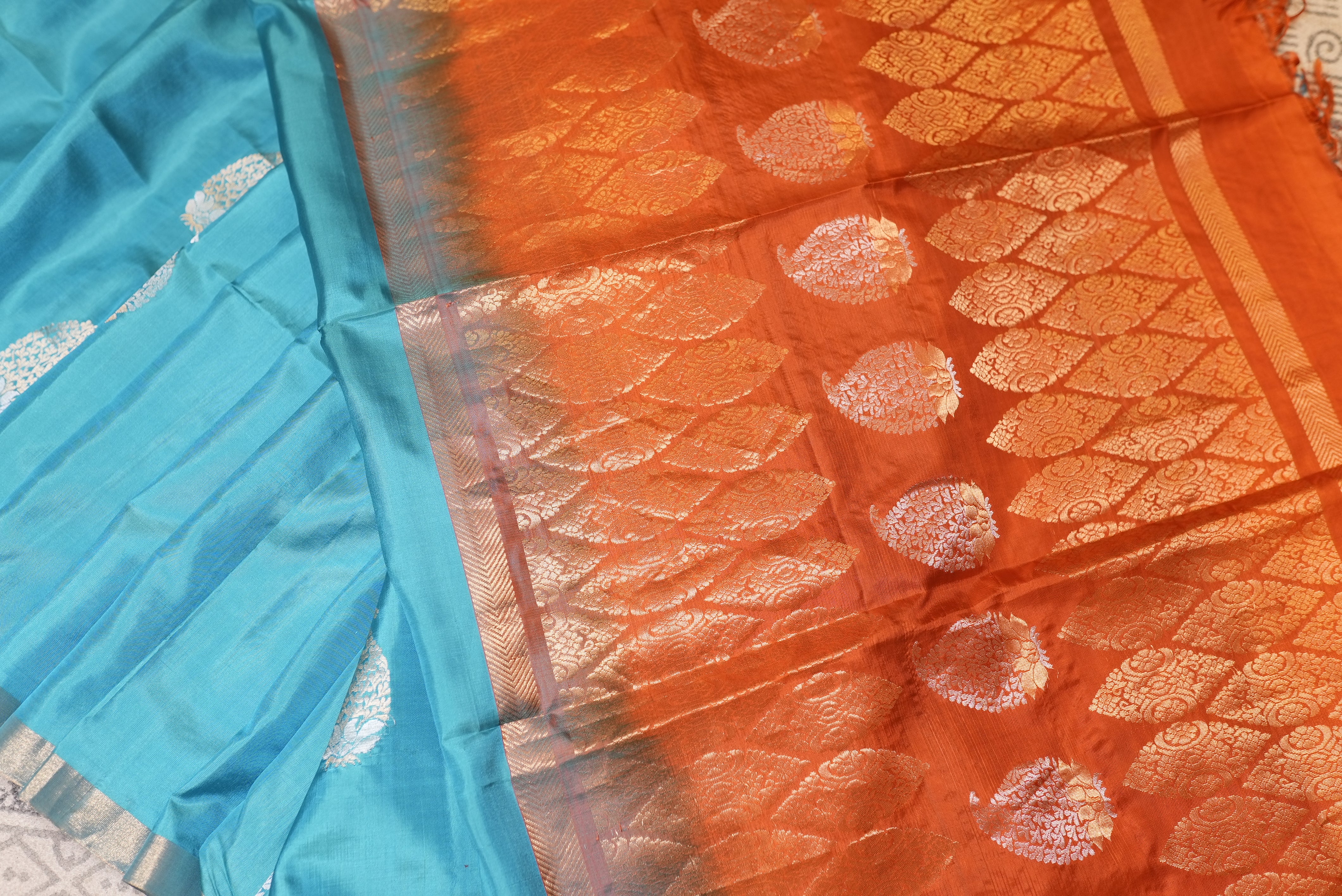 Sky blue with orange boarder kanjiwaram