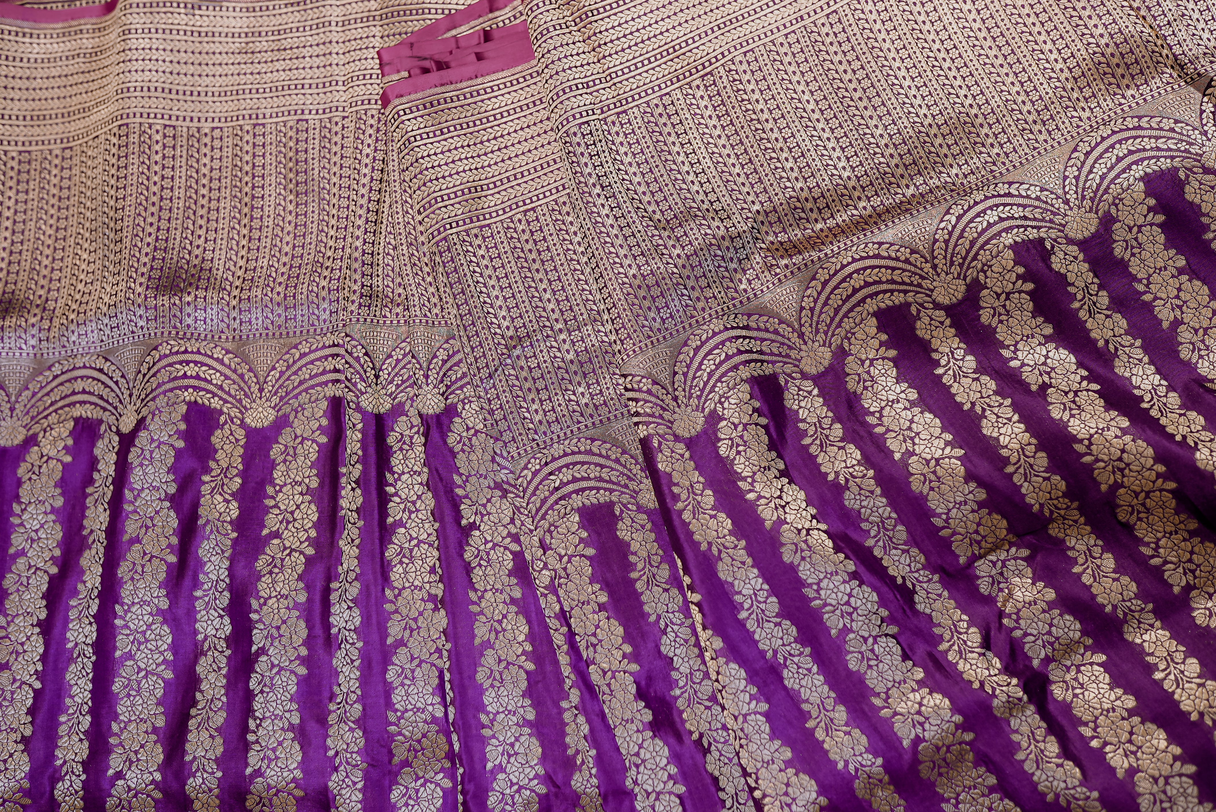 Purple banarasi saree with gold zari motifs and boarder