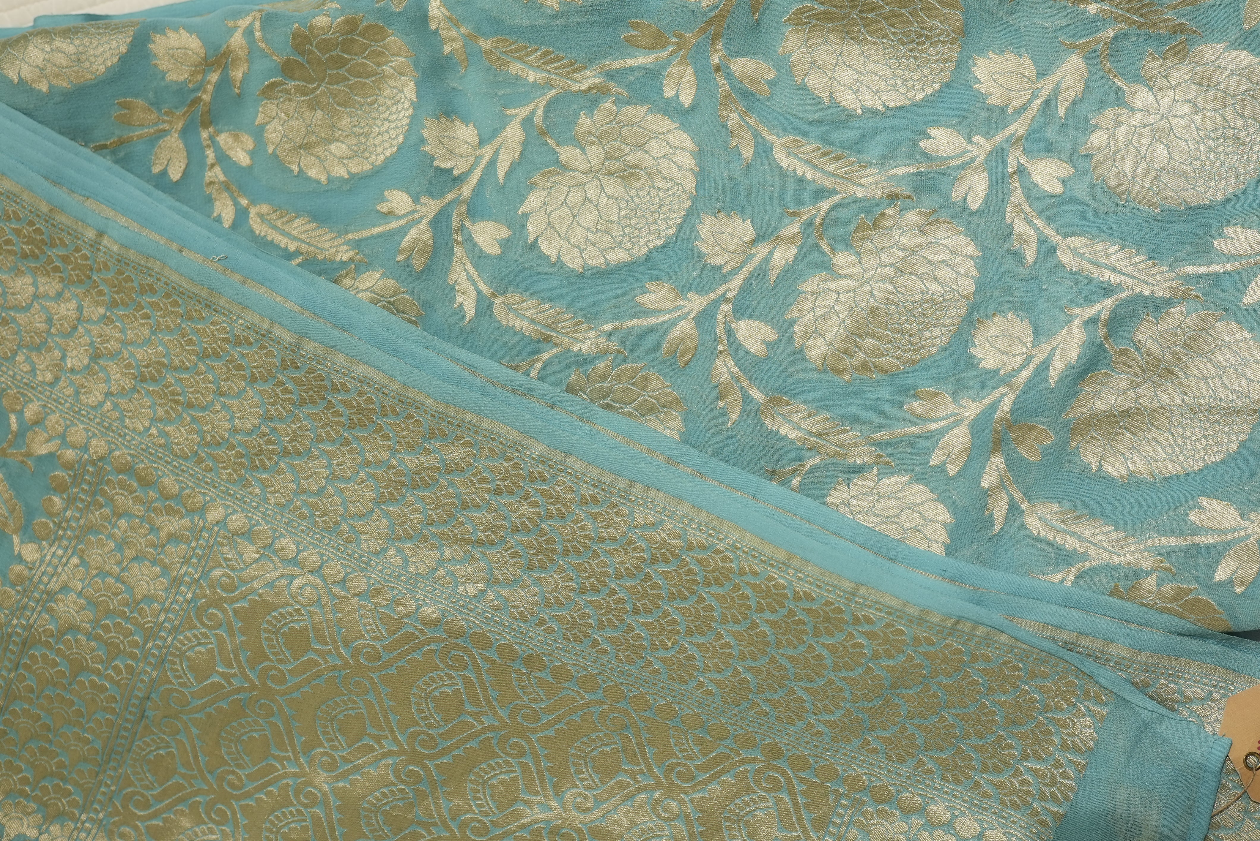 Sea green khaddi georgette saree with champagne gold zari full jaal work