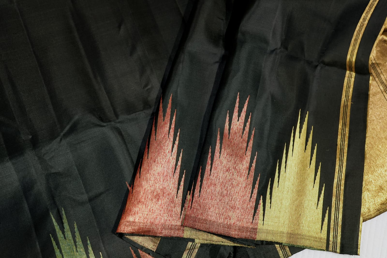 Black kanjiwaram saree with zari temple boarder