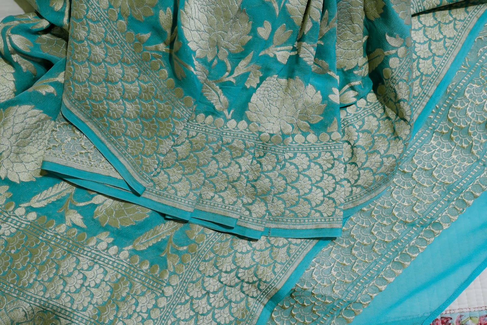 Sea green khaddi georgette saree with champagne gold zari full jaal work