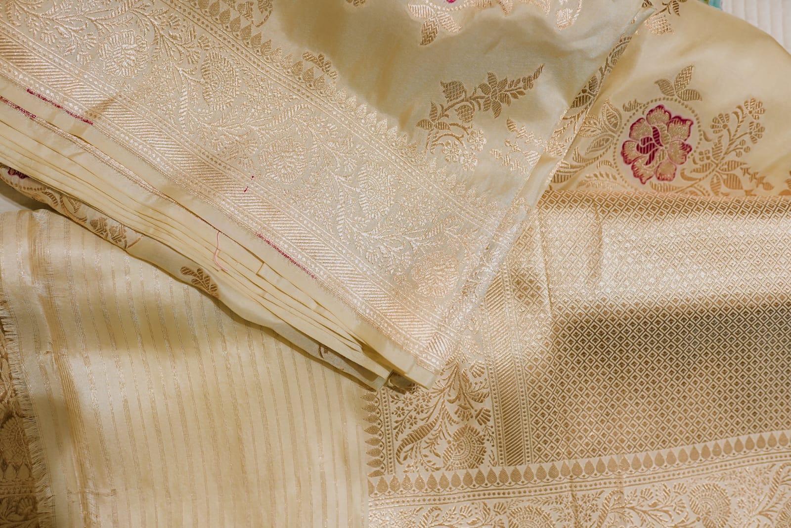 Beige banarasi saree with golden zari floral motifs
